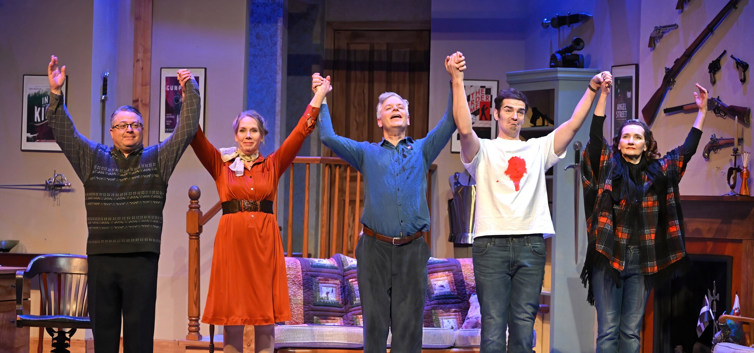 A colourful photo of the David Long Stage dressed for the 2025 November LCP Production of Deathtrap. The 5 actors hold hands for their final bow.